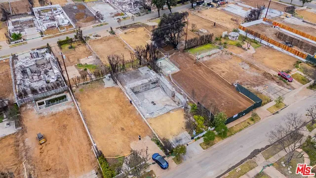 an aerial view of a house with a garden