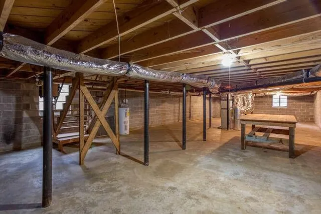 a view of empty room with wooden walls