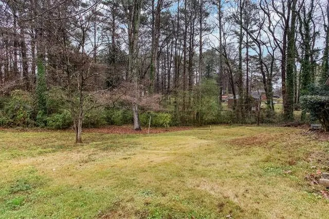 a view of a backyard of the house
