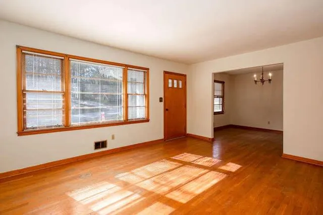 a view of an empty room with a window