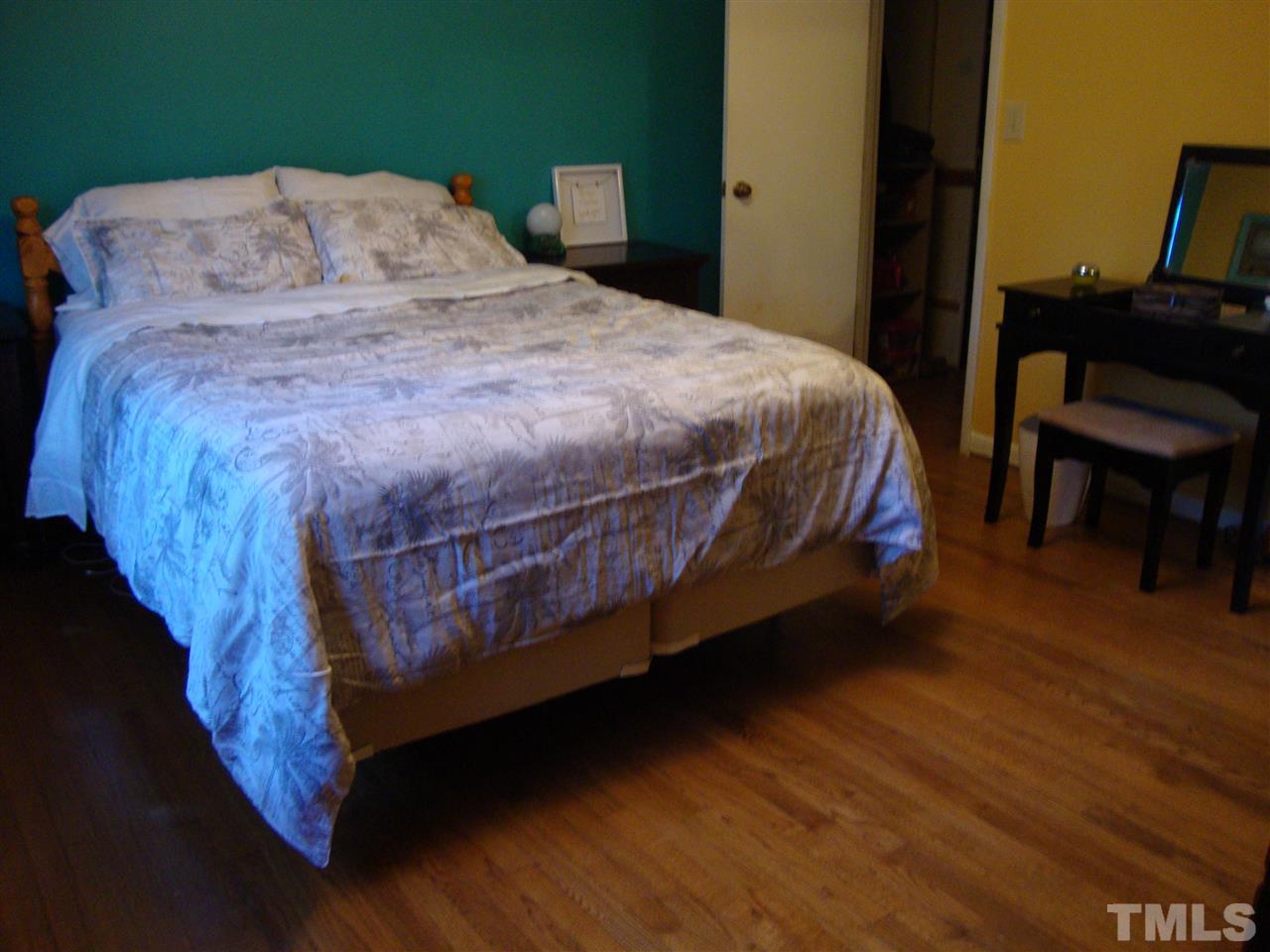 6901 Brecken Ridge Avenue Raleigh, NC 27615 - Photo 12 of 17 Large Master bedroom, also has a walk in closed, and hardwood floor.