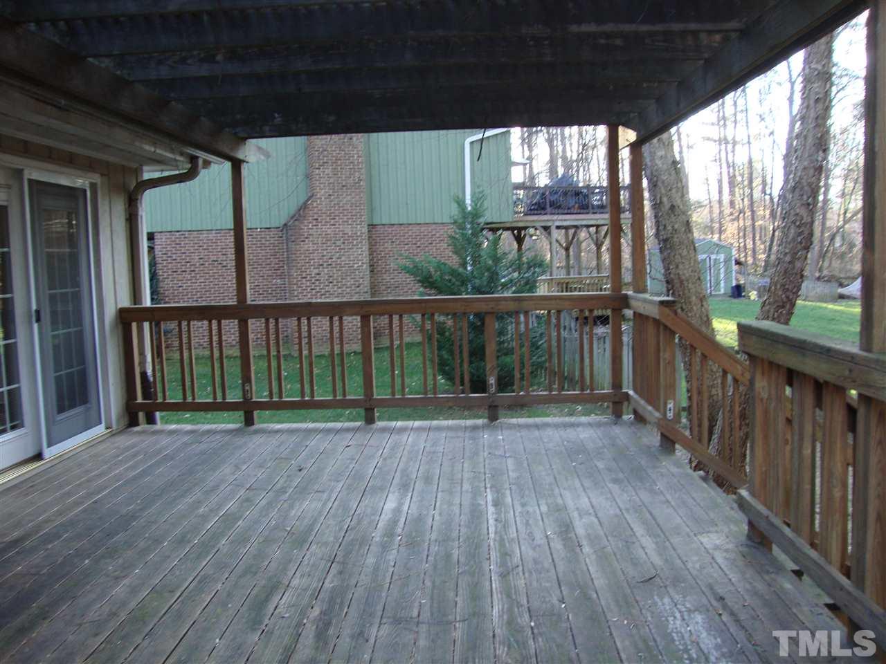 6901 Brecken Ridge Avenue Raleigh, NC 27615 - Photo 14 of 17 This part of the deck has an arbor covering. All you need is a grapevine, and you could be making you own wine.