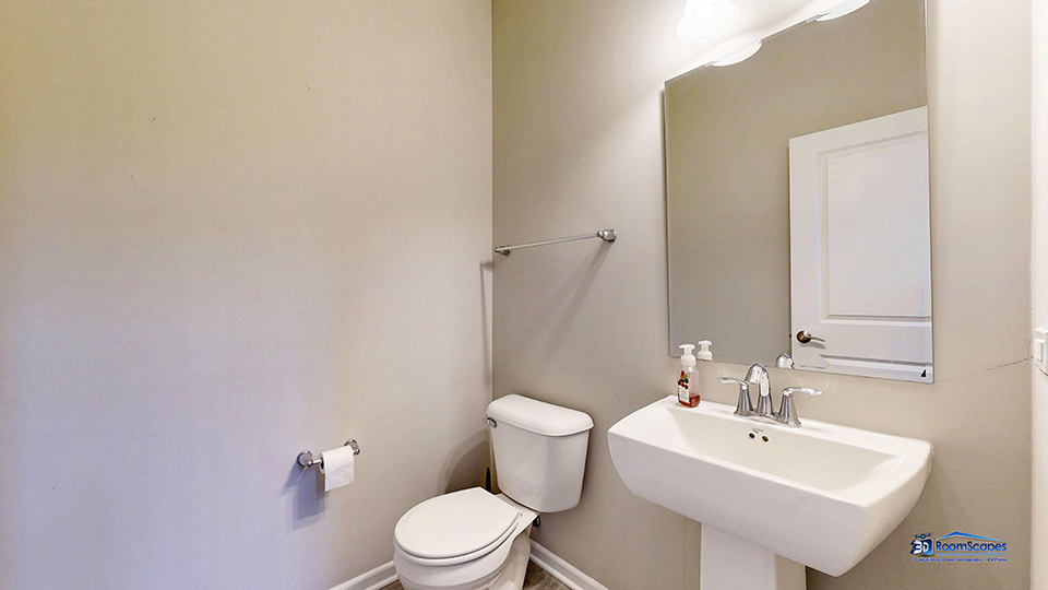 1255 Danforth Court Vernon Hills, IL 60061 - Photo 8 of 17 a bathroom with a sink mirror and toilet
