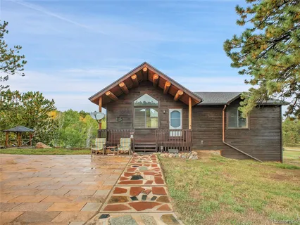 a view of livingroom with an empty space and a fireplace
