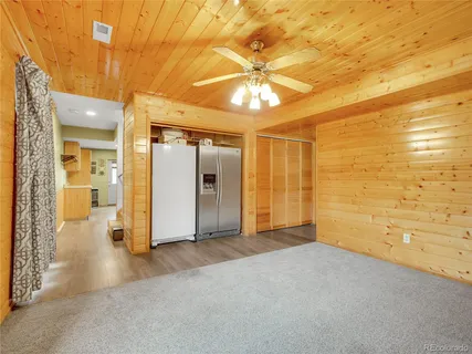 an empty room with a empty space and windows