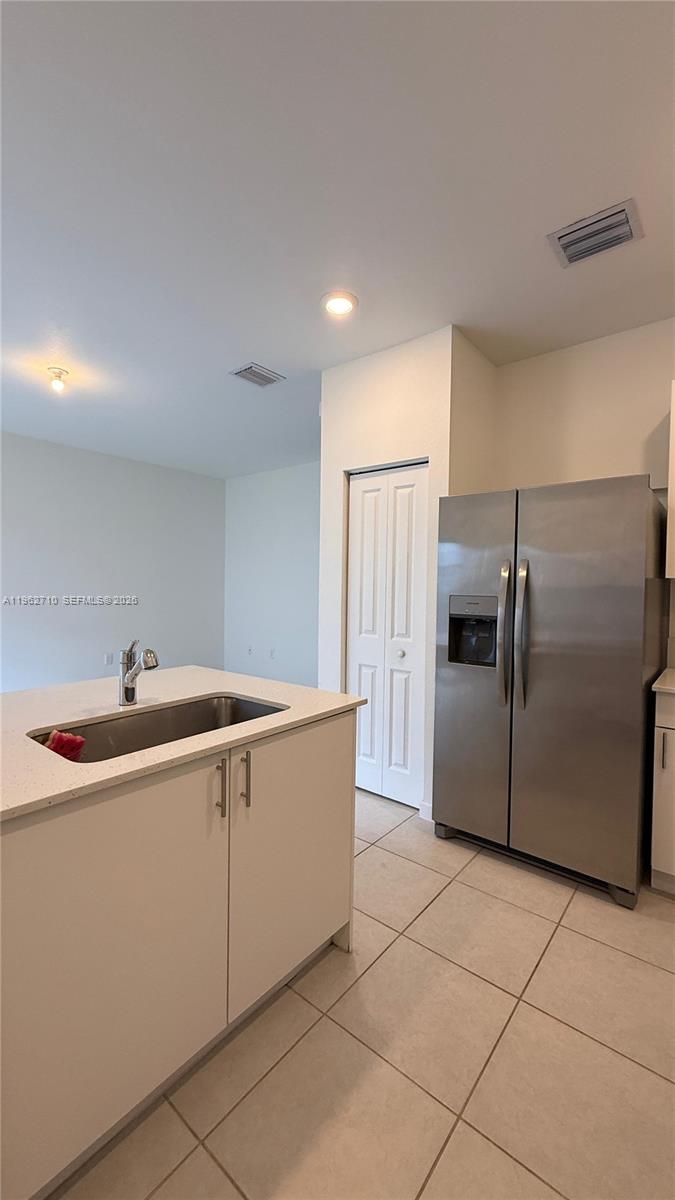 16244 Southwest 291st Street, Unit 16244 Homestead, FL 33033 - Photo 19 of 49 a kitchen with a sink and refrigerator