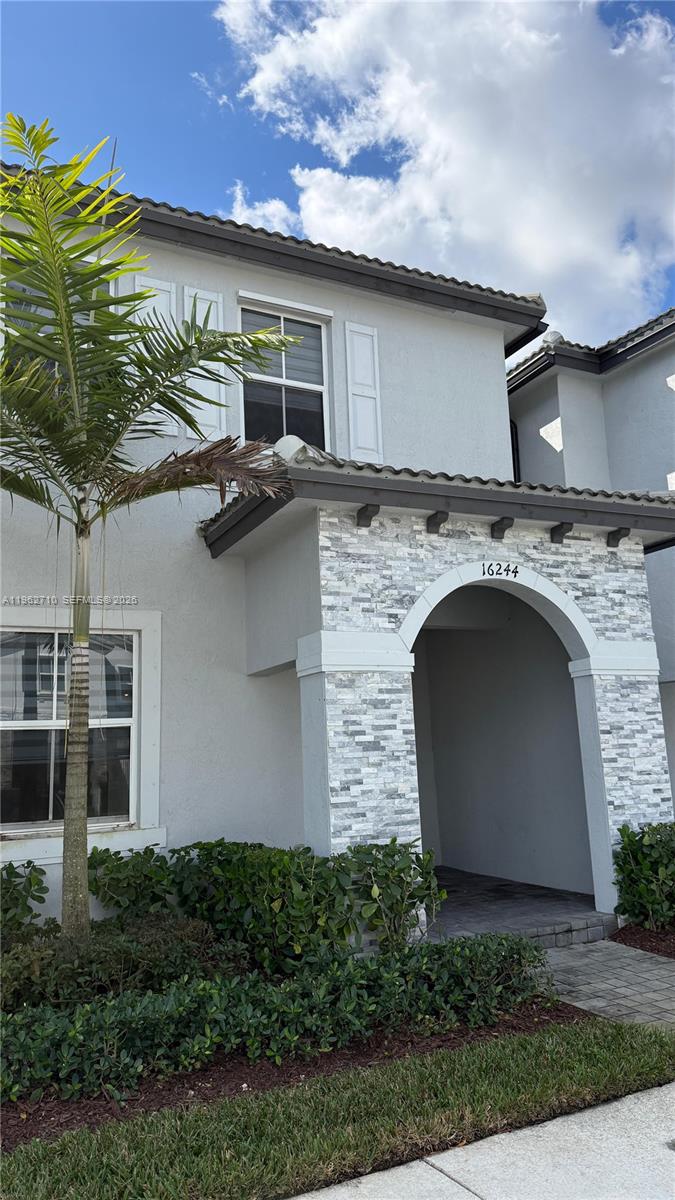 16244 Southwest 291st Street, Unit 16244 Homestead, FL 33033 - Photo 2 of 49 a view of a house with a patio