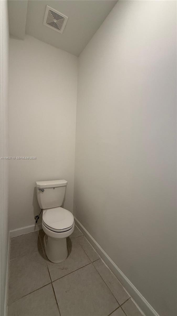 16244 Southwest 291st Street, Unit 16244 Homestead, FL 33033 - Photo 22 of 49 a white toilet sitting next to a white sink