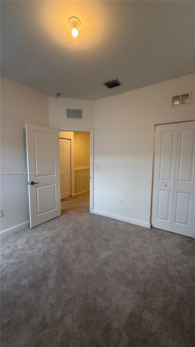 16244 Southwest 291st Street, Unit 16244 Homestead, FL 33033 - Photo 28 of 49 a view of an empty room and closet area