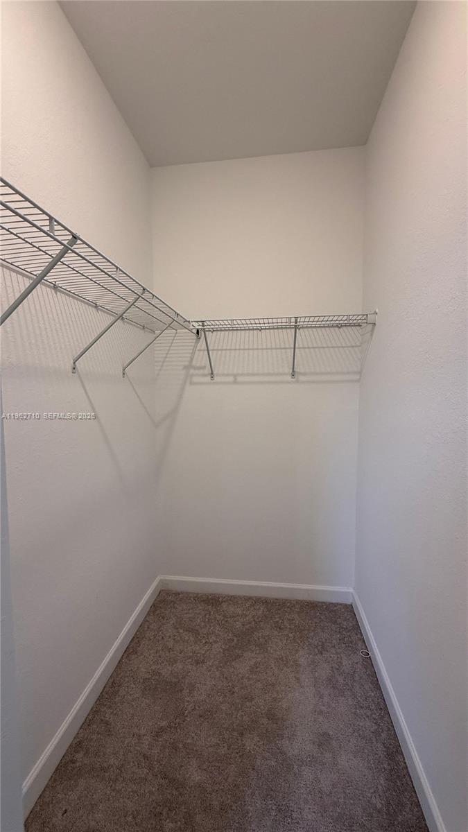 16244 Southwest 291st Street, Unit 16244 Homestead, FL 33033 - Photo 31 of 49 a view of a room with racks on the wall