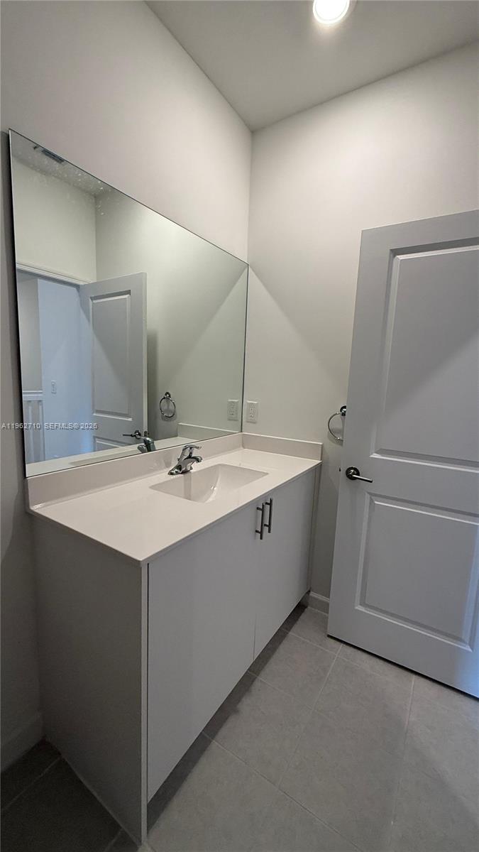 16244 Southwest 291st Street, Unit 16244 Homestead, FL 33033 - Photo 34 of 49 a bathroom with a sink and mirror