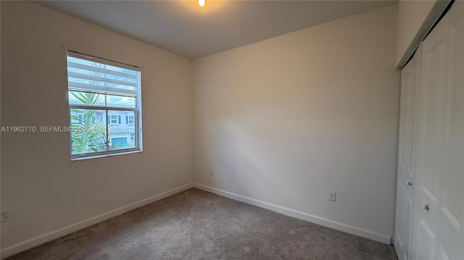16244 Southwest 291st Street, Unit 16244 Homestead, FL 33033 - Photo 35 of 49 an empty room with a window