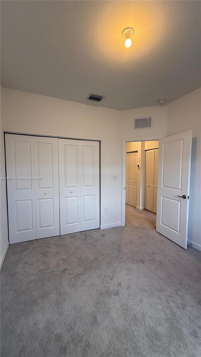16244 Southwest 291st Street, Unit 16244 Homestead, FL 33033 - Photo 37 of 49 a view of an empty room