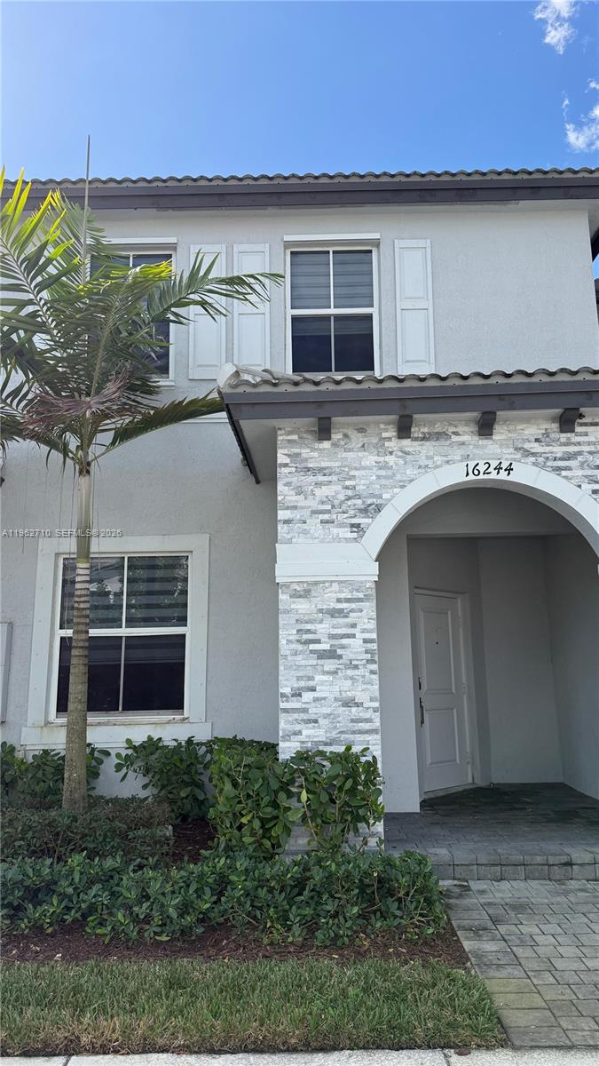 16244 Southwest 291st Street, Unit 16244 Homestead, FL 33033 - Photo 4 of 49 a view of a house with a tub and garage