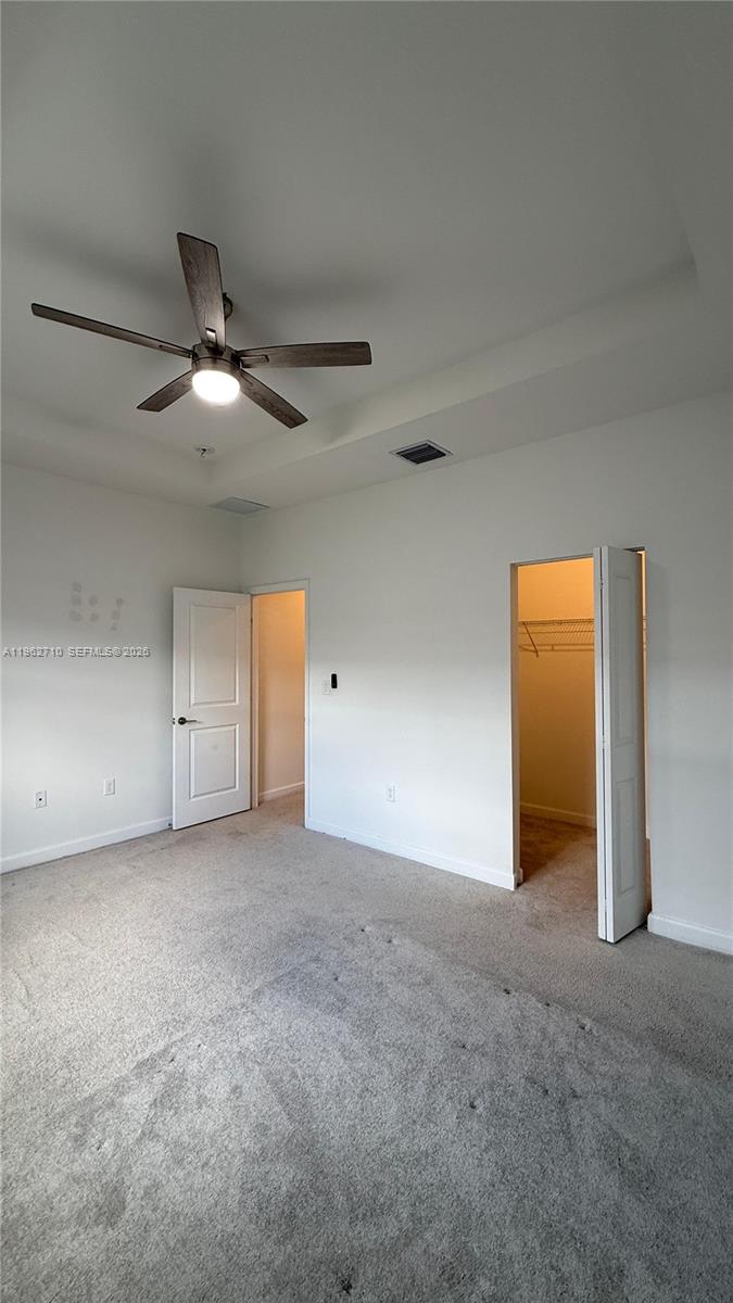 16244 Southwest 291st Street, Unit 16244 Homestead, FL 33033 - Photo 42 of 49 a view of an empty room with a ceiling fan
