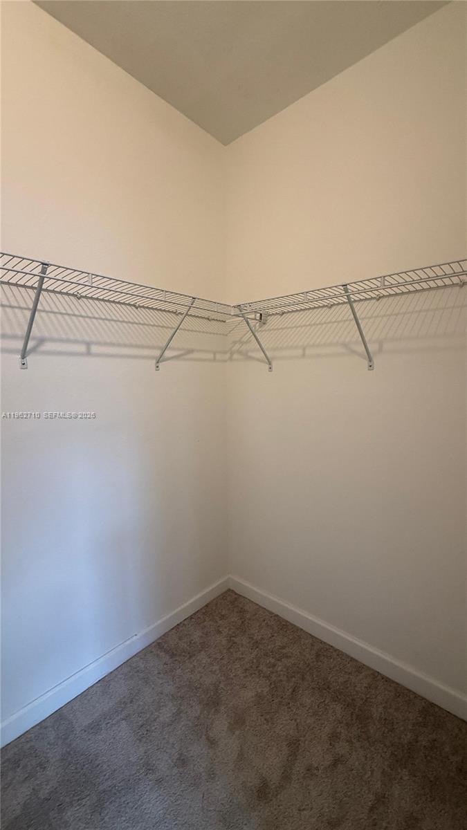 16244 Southwest 291st Street, Unit 16244 Homestead, FL 33033 - Photo 43 of 49 a view of a room with racks on the wall