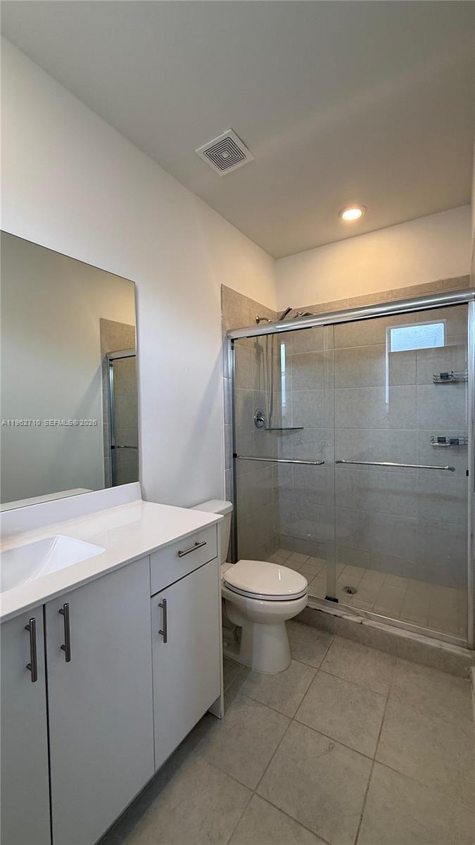 16244 Southwest 291st Street, Unit 16244 Homestead, FL 33033 - Photo 44 of 49 a bathroom with a sink a toilet and shower