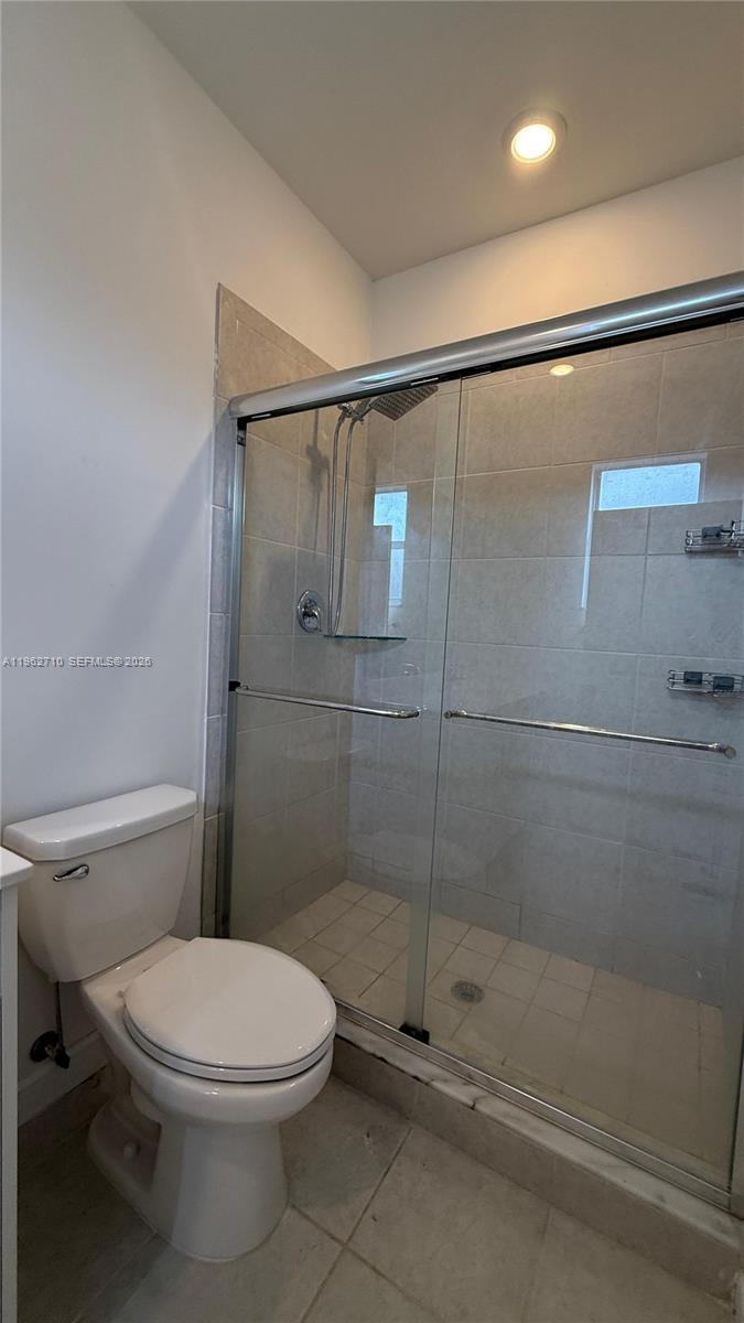 16244 Southwest 291st Street, Unit 16244 Homestead, FL 33033 - Photo 48 of 49 a bathroom with a toilet and a shower