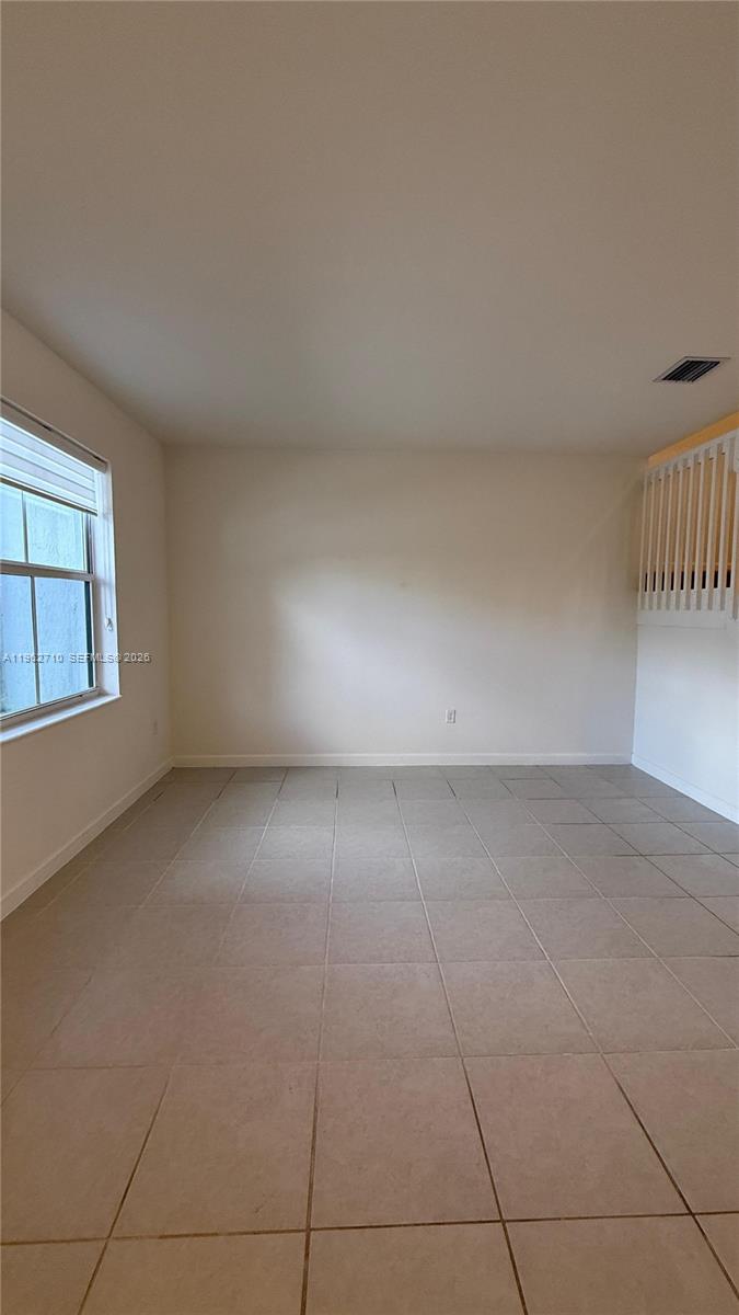16244 Southwest 291st Street, Unit 16244 Homestead, FL 33033 - Photo 7 of 49 a view of an empty room with a window