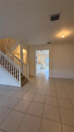 a view of an entryway with a hallway