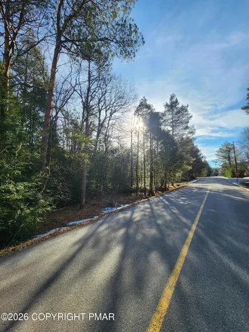 a view of a street with a building in the background