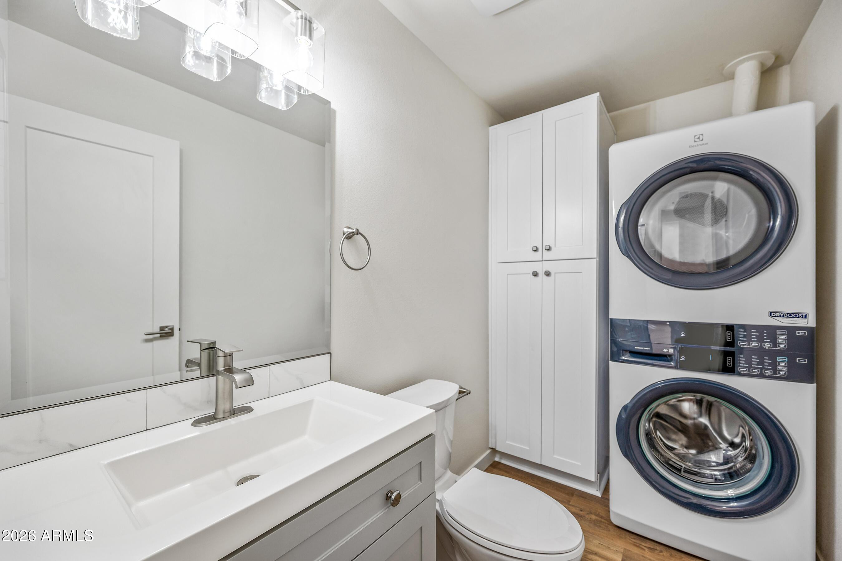 4139 North 27th Street, Unit 4 Phoenix, AZ 85016 - Photo 14 of 29 a bathroom with a sink a washer and dryer