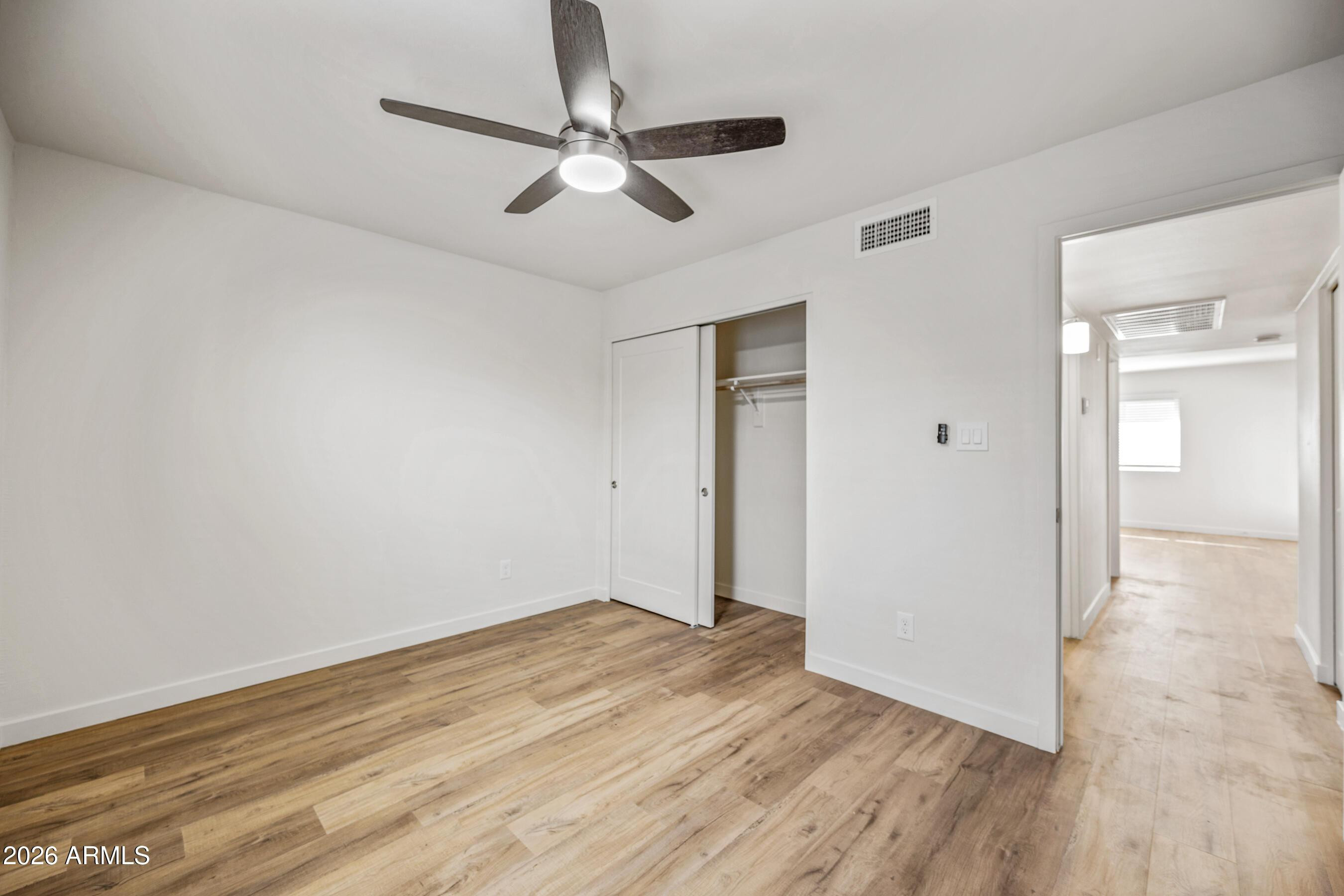 4139 North 27th Street, Unit 4 Phoenix, AZ 85016 - Photo 19 of 29 a view of empty room with wooden floor