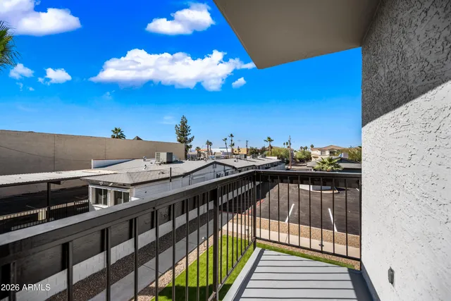 a view of a balcony with sitting area