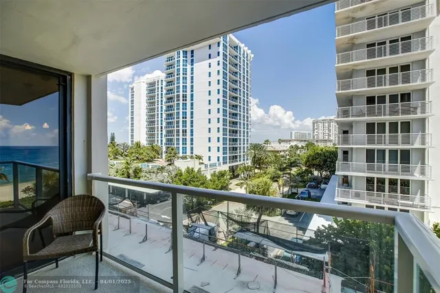 a view of a balcony with chairs
