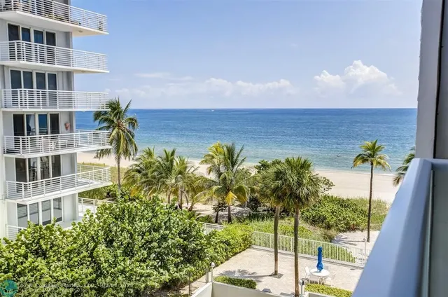 a view of a lake with a building in the background