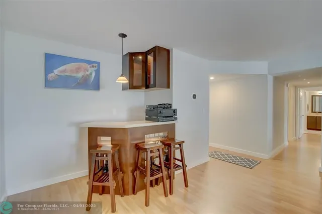 a view of a livingroom with furniture and wooden floor