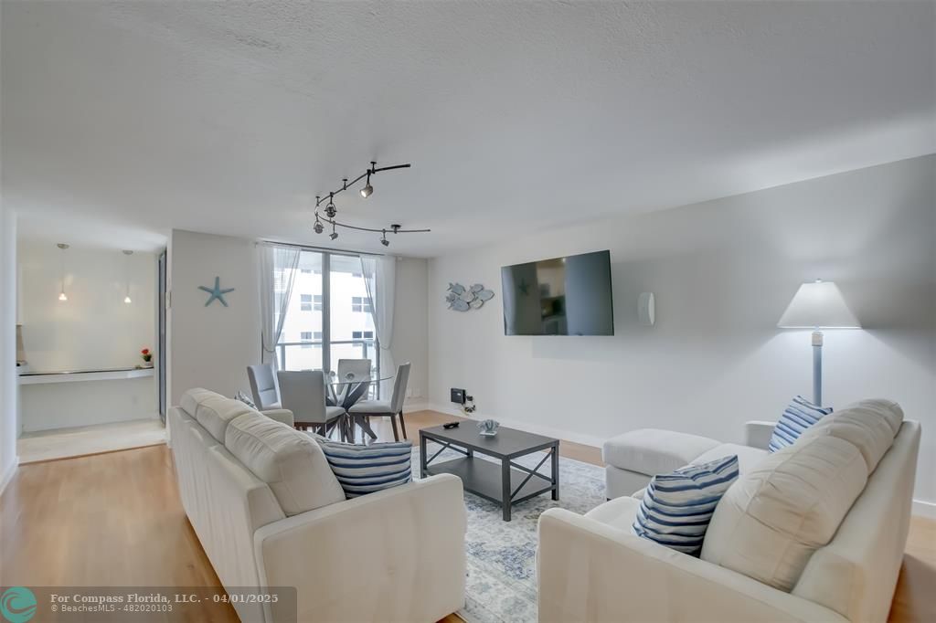 1000 South Ocean Boulevard, Unit 5O Pompano Beach, FL 33062 - Photo 3 of 42 a living room with furniture and a lamp