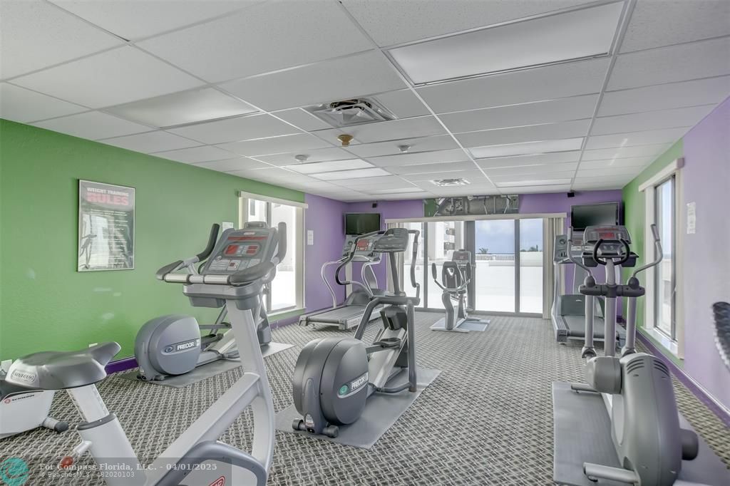 1000 South Ocean Boulevard, Unit 5O Pompano Beach, FL 33062 - Photo 32 of 42 a room with furniture gym equipment and windows