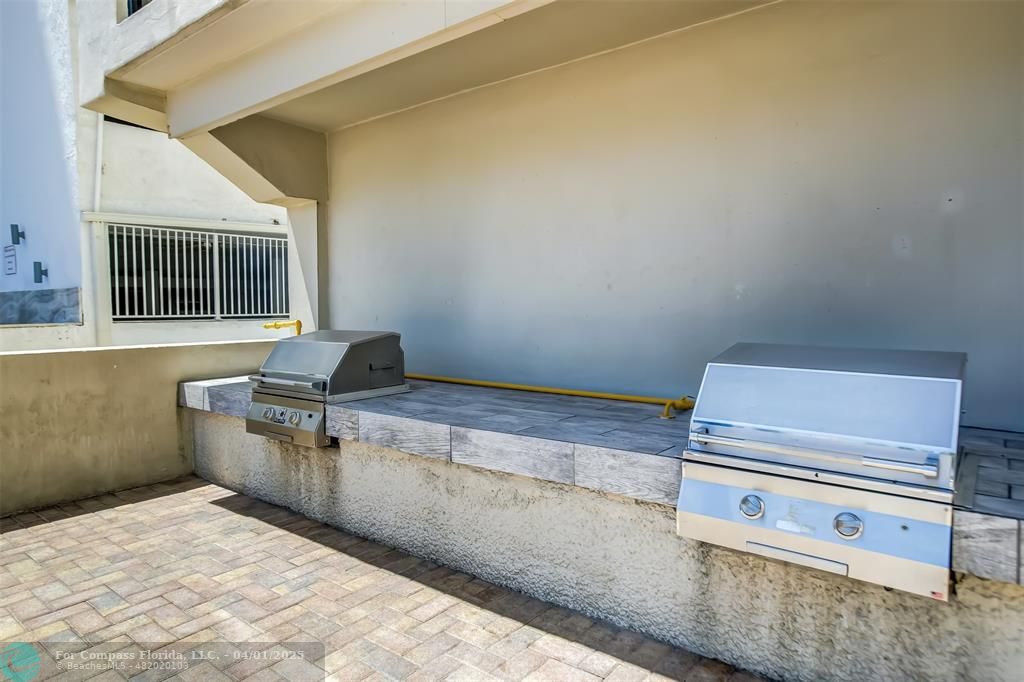 1000 South Ocean Boulevard, Unit 5O Pompano Beach, FL 33062 - Photo 37 of 42 a kitchen with a stove and a sink