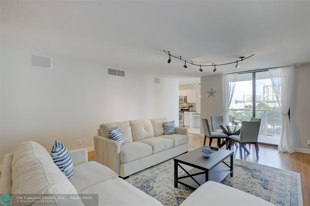 1000 South Ocean Boulevard, Unit 5O Pompano Beach, FL 33062 - Photo 4 of 42 a living room with furniture and wooden floor