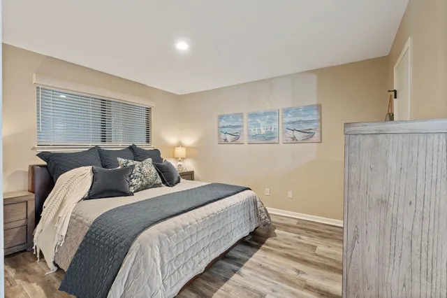 a bedroom with bed and a window