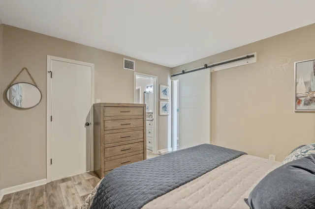 a bedroom with a bed and a closet