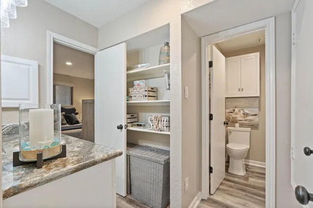 a kitchen with a sink and toilet