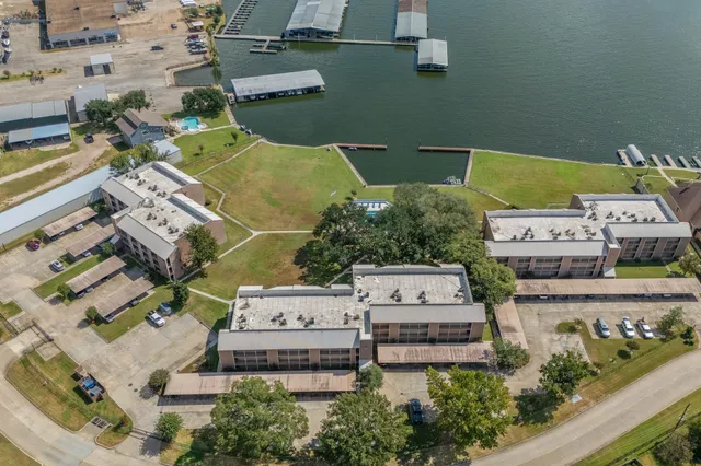 an aerial view of a house with a swimming pool