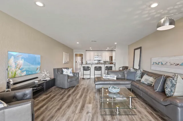 a living room with furniture and a table