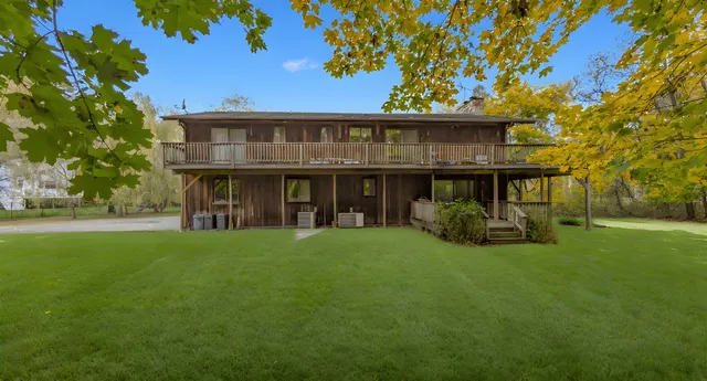 a view of an house with backyard space and garden