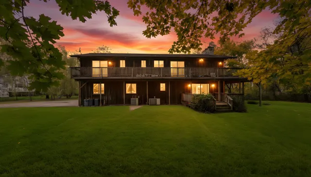 a view of house with a yard