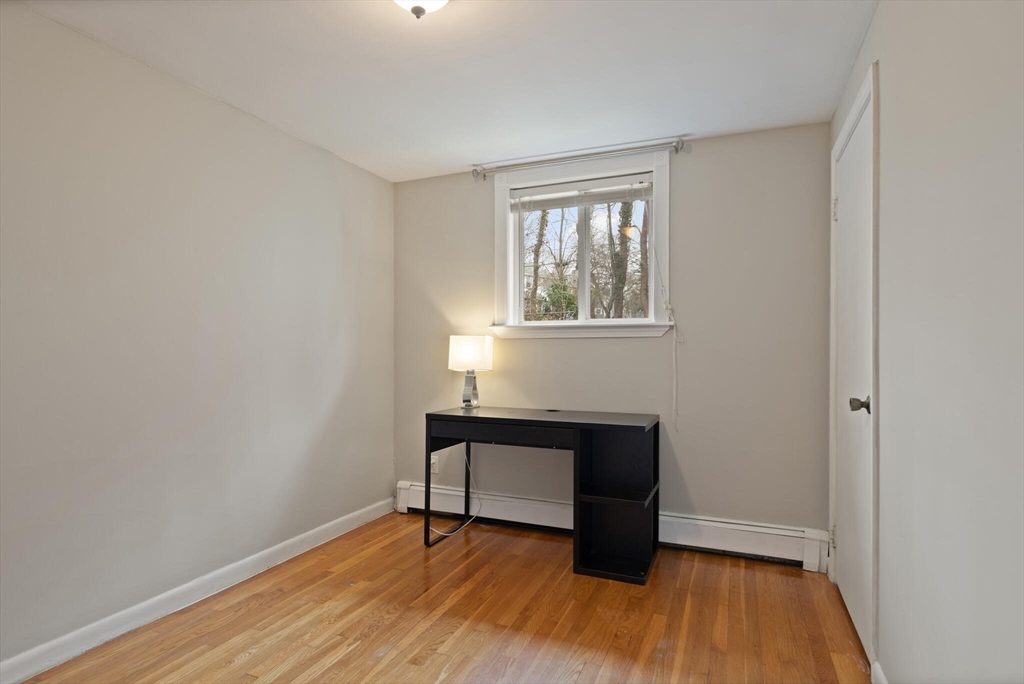 50 Thurston Road, Unit 50 Newton, MA 02464 - Photo 18 of 26 a bench sitting in a room next to a window