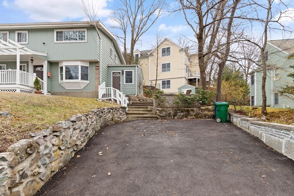 50 Thurston Road, Unit 50 Newton, MA 02464 - Photo 23 of 26 a front view of a house with garden
