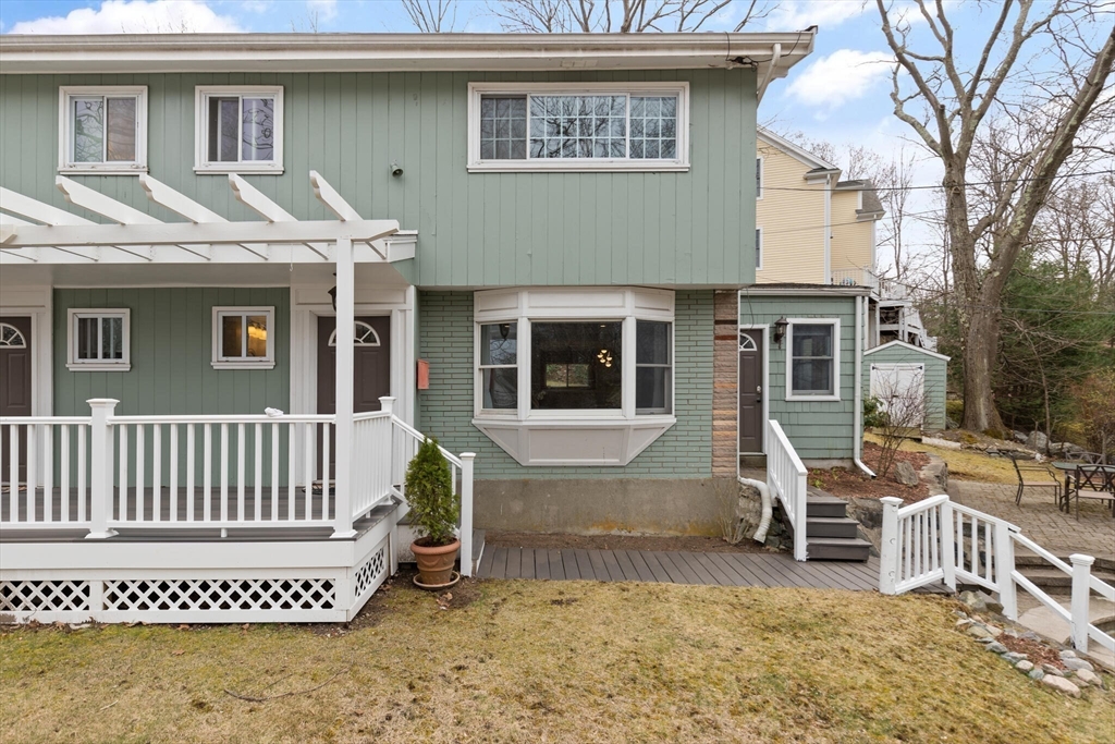 50 Thurston Road, Unit 50 Newton, MA 02464 - Photo 4 of 26 a front view of a house with a porch