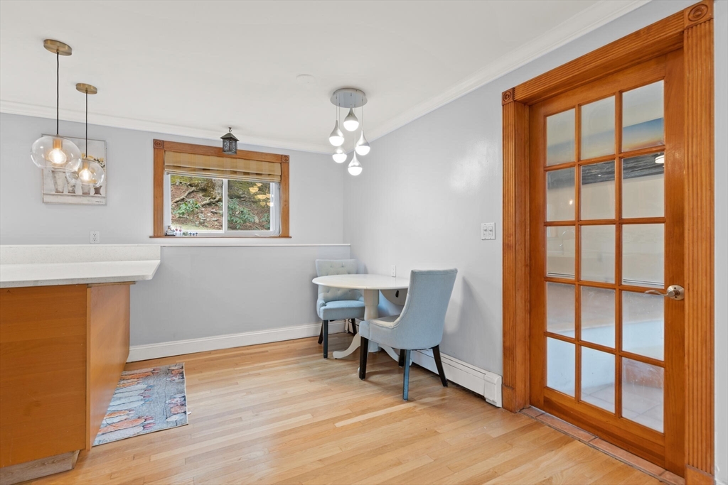 50 Thurston Road, Unit 50 Newton, MA 02464 - Photo 8 of 26 a workspace with wooden floor and a window