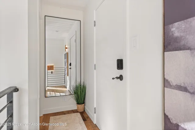 a view of a bathroom from a hallway