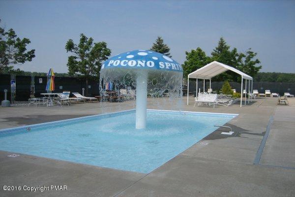 1034 Beaver Run Road Newfoundland, PA 18445 - Photo 16 of 23 a patio with a table and chairs under an umbrella