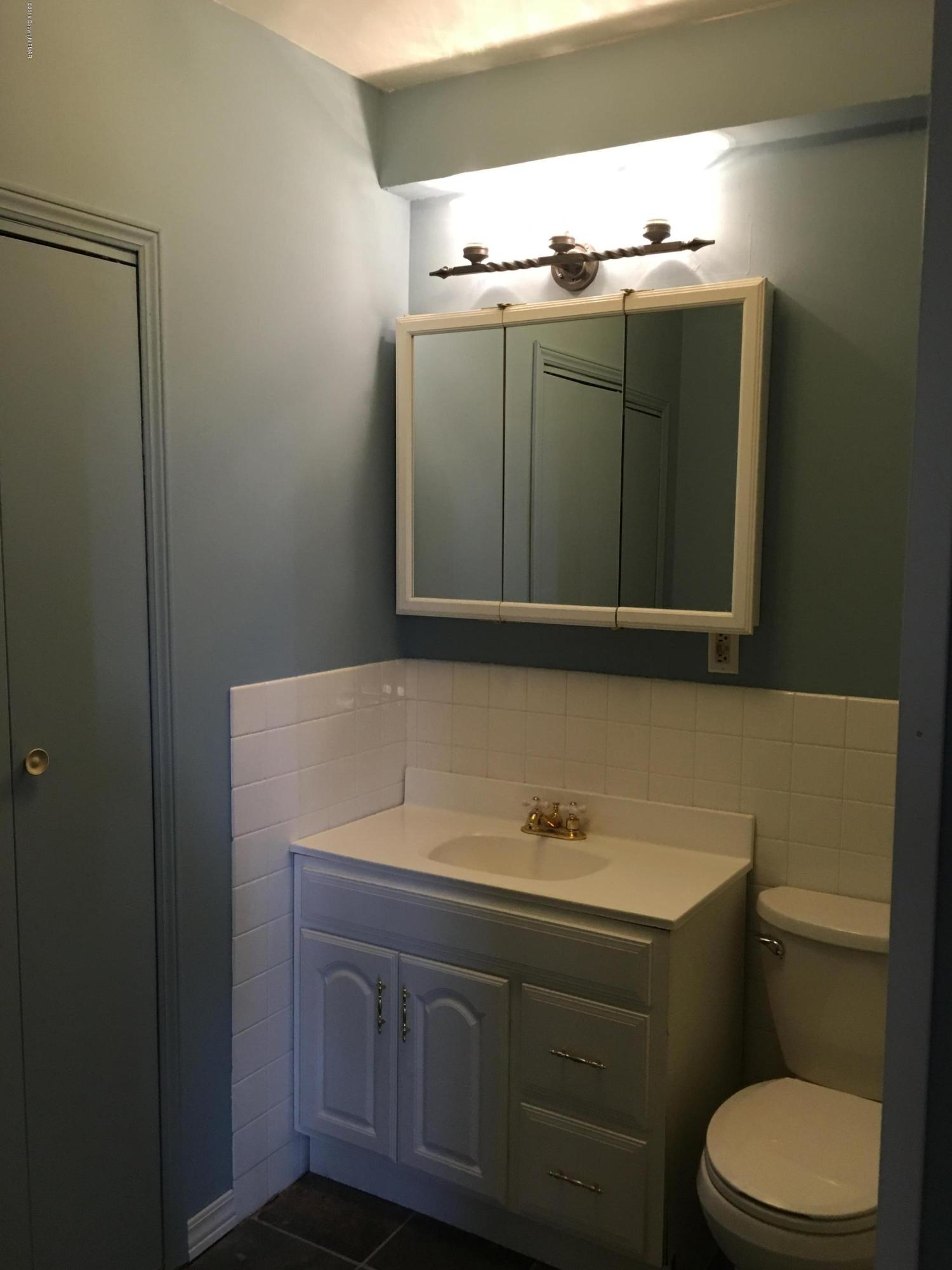 1034 Beaver Run Road Newfoundland, PA 18445 - Photo 7 of 23 a bathroom with a sink and mirror