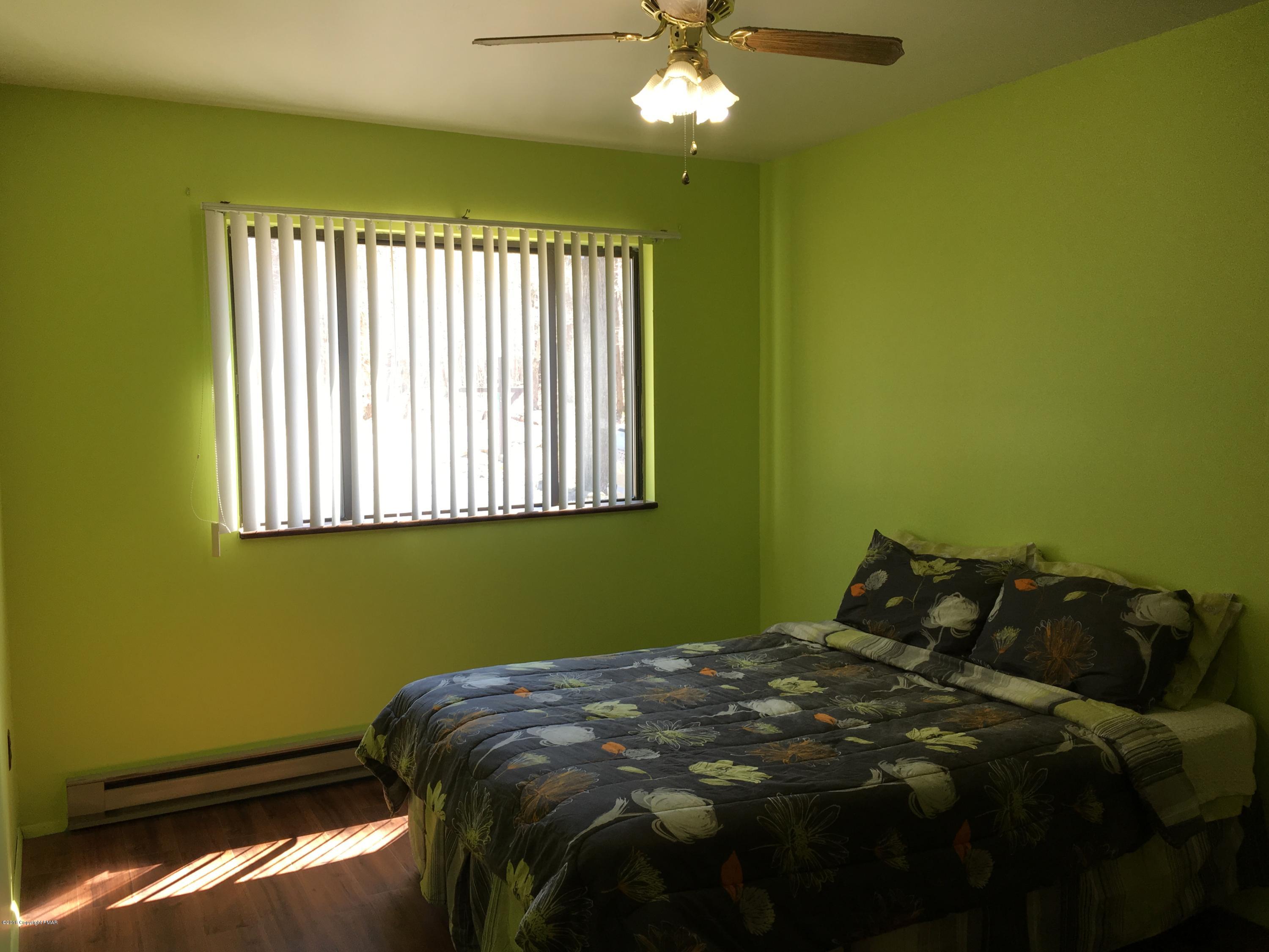 1034 Beaver Run Road Newfoundland, PA 18445 - Photo 8 of 23 a bedroom with bed and window